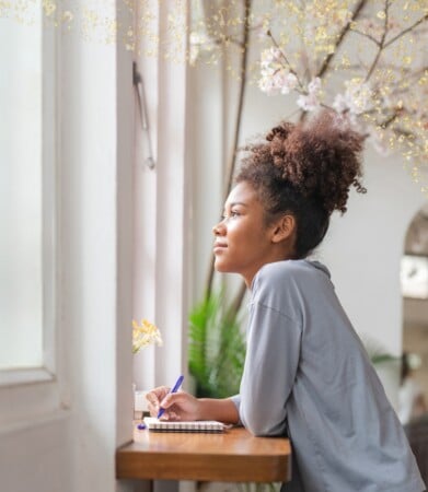 woman writing in journal